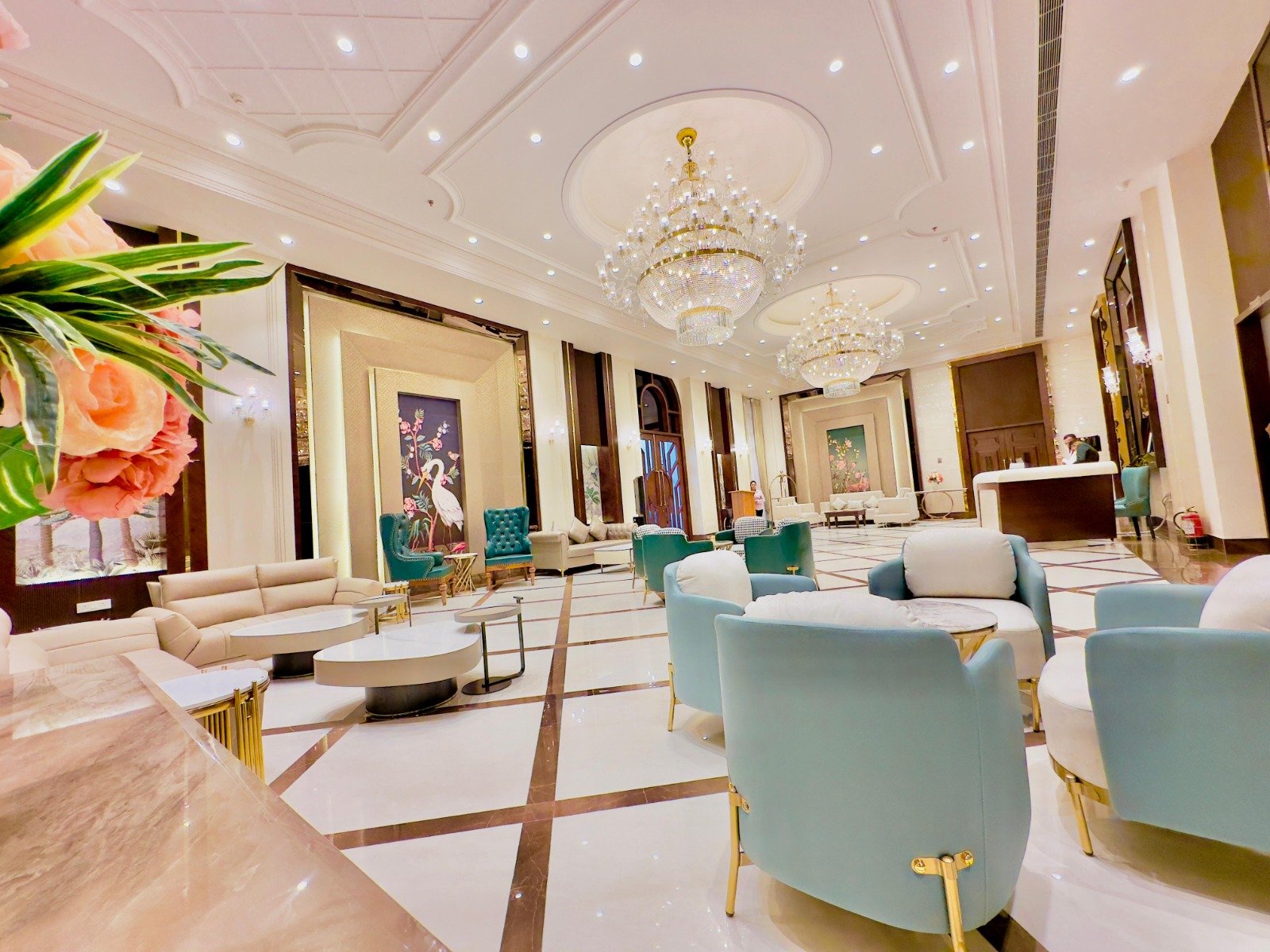 Elegant green lounge with rattan armchairs